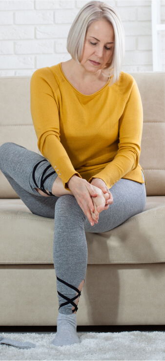 Senior checking feet