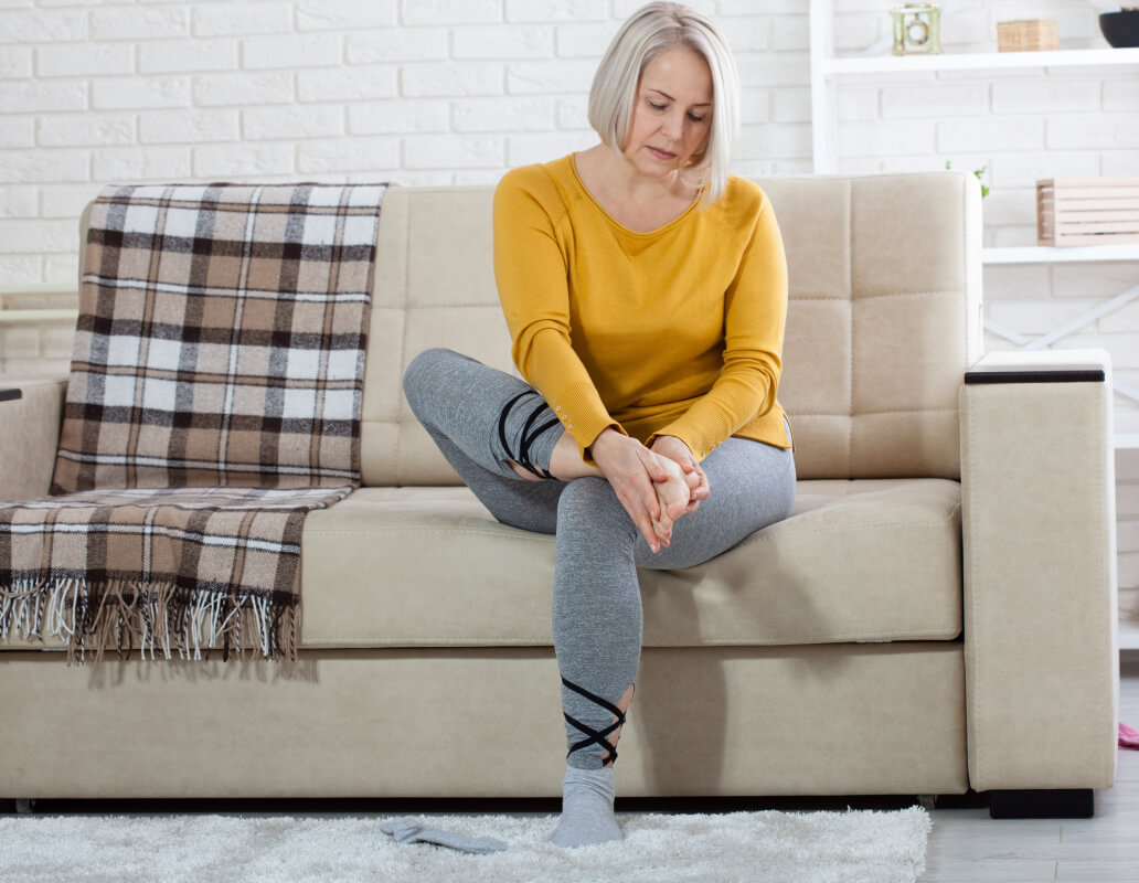 Senior checking feet