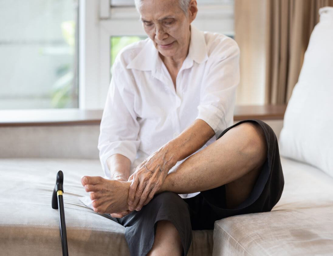 Senior checking feet